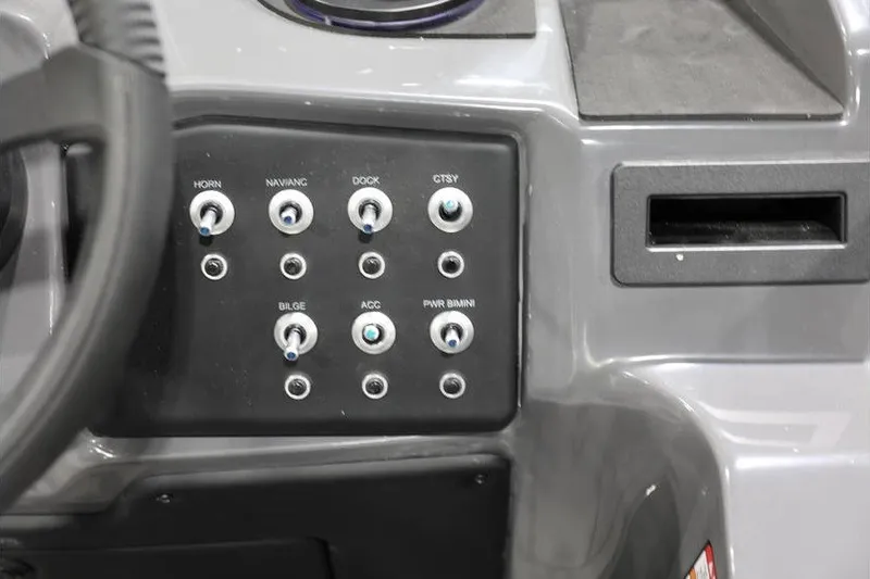 Slide: The Image of Control panel of 2026 Evotti 523QL boat with labeled switches for various functions. - 14
