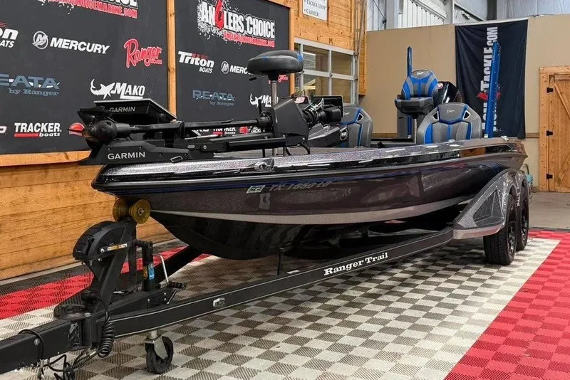 Slide: The Image of 2025 Ranger Z520R Cup-Equipped boat on display in showroom with Garmin equipment. - 2