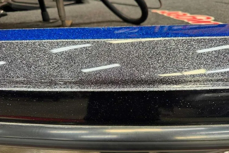 Slide: The Image of Close-up of 2025 Ranger Z520R Cup-Equipped boat with metallic blue and silver finish. - 11