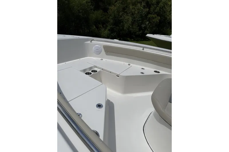 Slide: The Image of 2027 Key West 203 FS boat interior with seating and cup holders. - 2