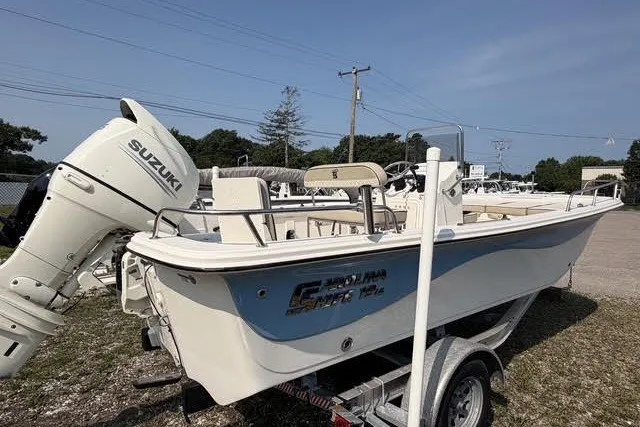 Slide: The Image of 2020 Carolina Skiff 19 LS boat with Suzuki outboard motor on trailer. - 1