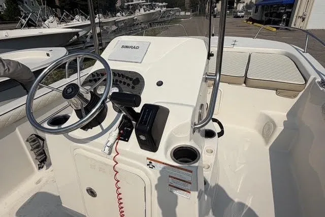 Slide: The Image of 2020 Carolina Skiff 19 LS boat interior with steering wheel and control panel. - 6
