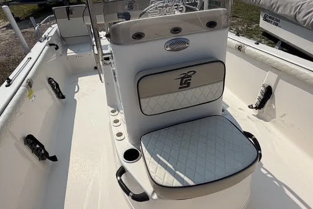 Slide: The Image of 2020 Carolina Skiff 19 LS boat interior with cushioned seating and console. - 11