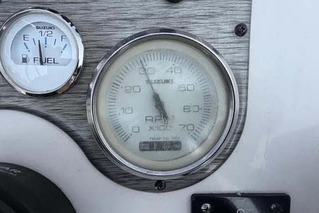 Slide: The Image of Dashboard gauges of a 2020 Carolina Skiff 19 LS boat, showing fuel and RPM levels. - 15