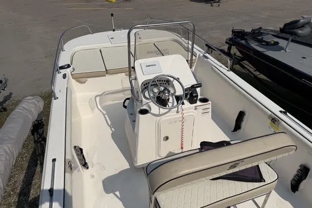 Slide: The Image of 2020 Carolina Skiff 19 LS boat interior with steering console and seating. - 16