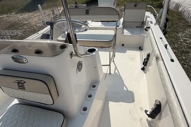 Slide: The Image of 2020 Carolina Skiff 19 LS boat interior with seating and steering console. - 12