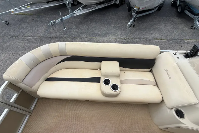 Slide: The Image of 2014 Godfrey SWEETWATER 2086 boat seating with cup holders, parked on a trailer. - 5