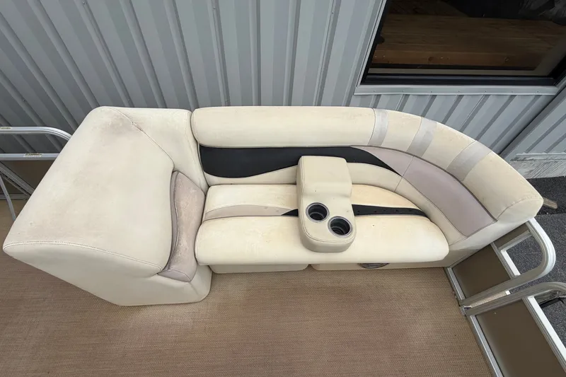 Slide: The Image of 2014 Godfrey SWEETWATER 2086 boat seating with cup holders, beige and black upholstery. - 3