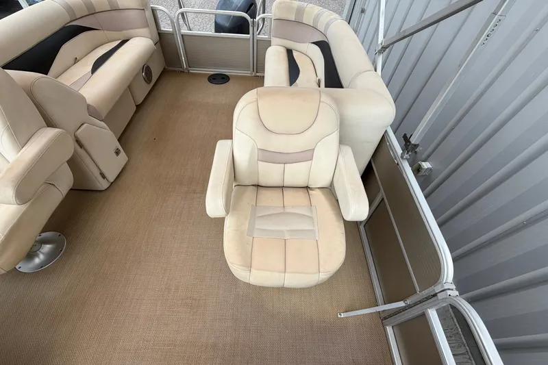 Slide: The Image of 2014 Godfrey SWEETWATER 2086 boat interior with beige seating and carpet flooring. - 4