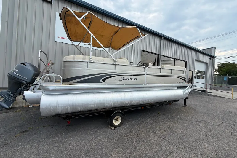 Slide: The Image of 2014 Godfrey SWEETWATER 2086 pontoon boat with canopy on trailer, parked outside. - 8