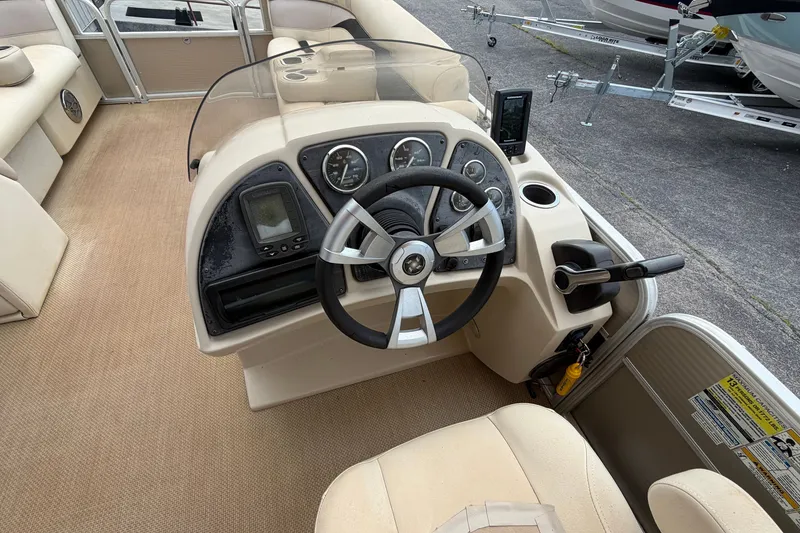 Slide: The Image of Interior view of 2014 Godfrey SWEETWATER 2086 boat dashboard with steering wheel and controls. - 10