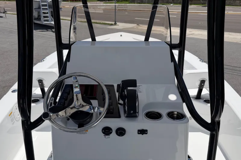 Slide: The Image of The image shows the helm of a 2026 BlackJack 224 boat with a steering wheel and instruments. - 15
