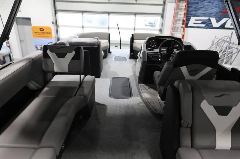 Slide: The Image of Interior of 2026 Evotti 523QL OMNI boat with modern seating and steering console. - 20