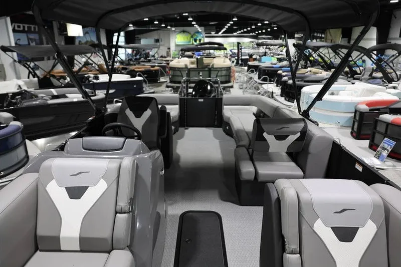 Slide: The Image of Interior view of 2026 Evotti 523QL OMNI boat at a showroom display. - 9