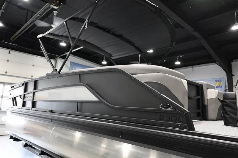Slide: The Image of 2026 Evotti 523QL OMNI pontoon boat in showroom, sleek design, modern interior. - 8