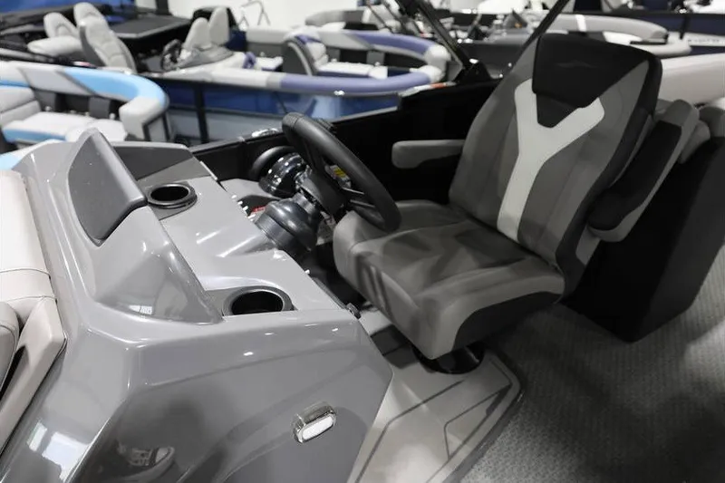 Slide: The Image of Interior of 2026 Evotti 523QL OMNI boat with modern steering and seating. - 15