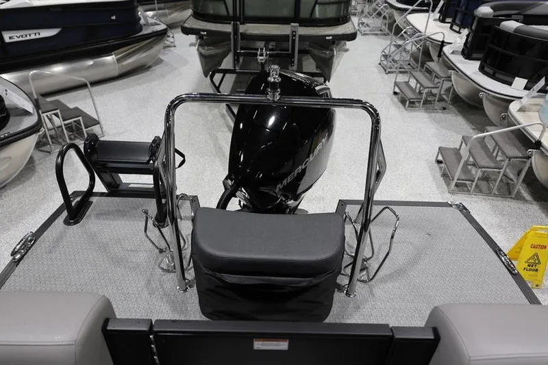 Slide: The Image of 2026 Evotti 523QL OMNI boat with Mercury engine in showroom display. - 23
