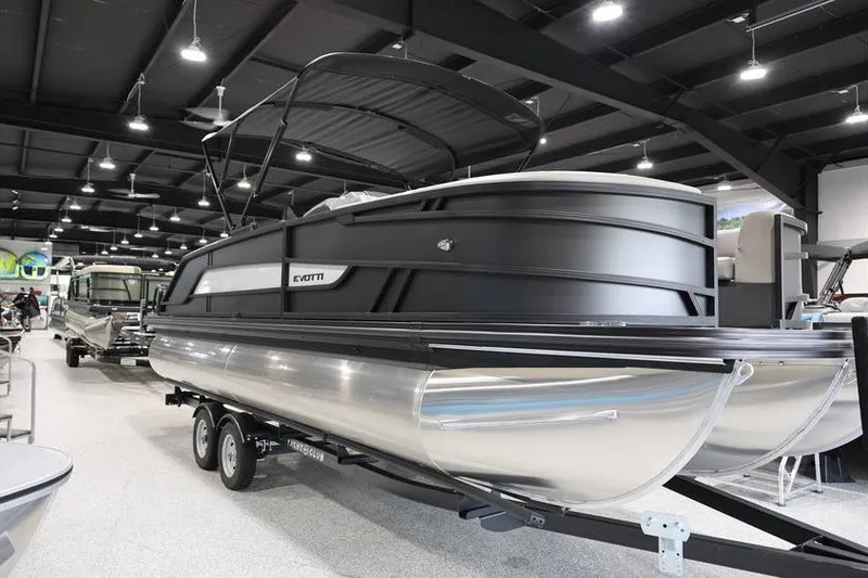 Slide: The Image of 2026 Evotti 523QL OMNI pontoon boat displayed in a showroom on a trailer. - 4