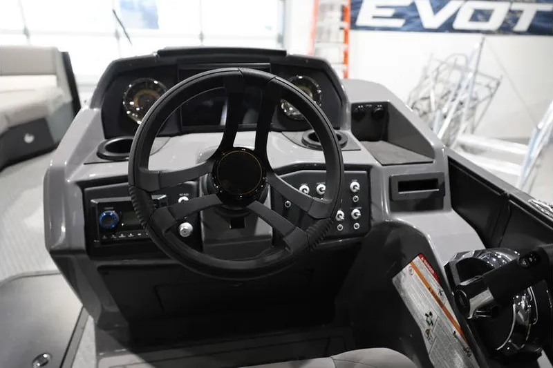 Slide: The Image of Steering console of 2026 Evotti 523QL OMNI boat with modern controls and dashboard. - 18