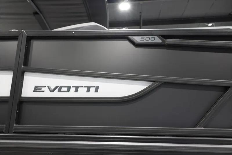 Slide: The Image of 2026 Evotti 523QL OMNI boat side view with sleek black design. - 5