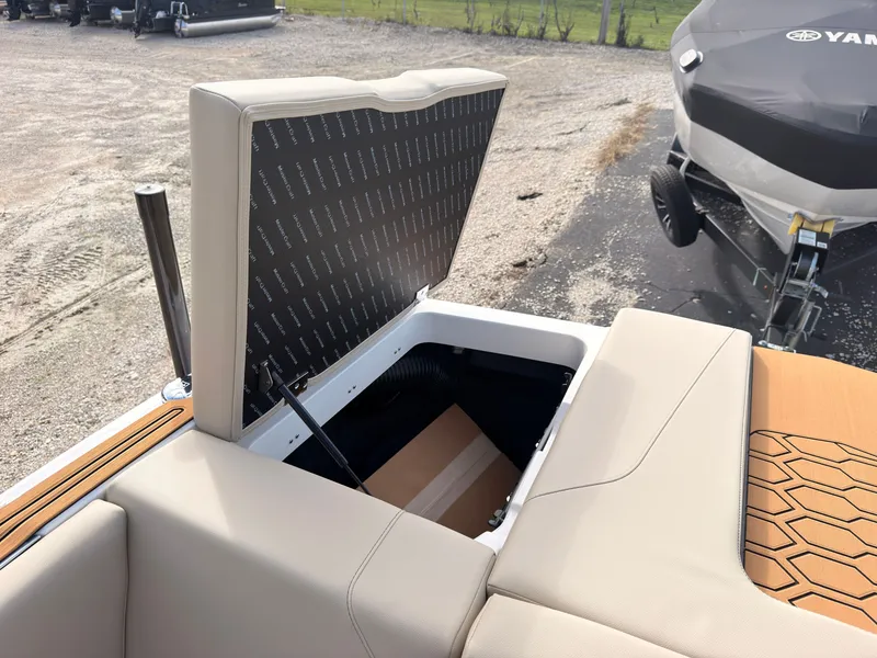 Slide: The Image of The 2027 MasterCraft NXT22 features an open storage compartment with cushioned seating and modern design. - 11