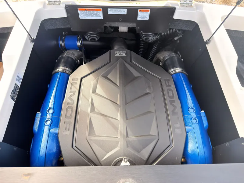 Slide: The Image of The engine compartment of a 2027 MasterCraft NXT22 features a powerful Ilmor engine with blue accents. - 15