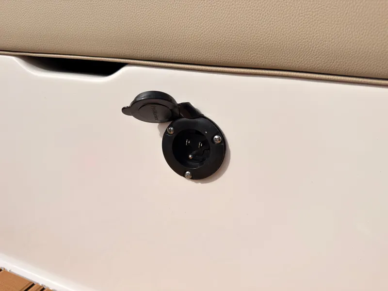Slide: The Image of Close-up of an outlet on a 2027 MasterCraft NXT22 boat. - 34
