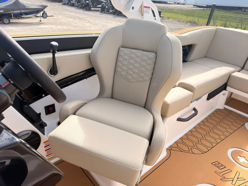 Slide: The Image of The interior of a 2027 MasterCraft NXT22 with beige upholstery and modern design. - 42
