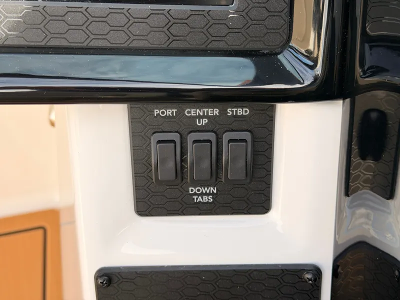 Slide: The Image of Close-up of control buttons on a boat, featuring options for port, center, and starboard. - 49