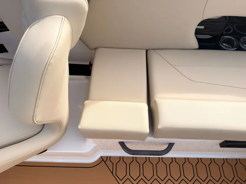 Slide: The Image of The interior of the 2027 MasterCraft NXT22 features beige upholstery and a modern design. - 19