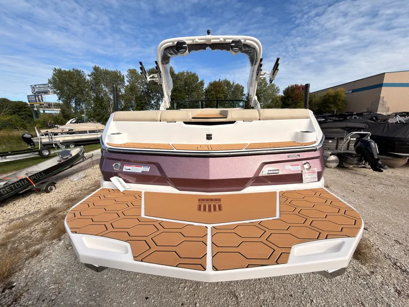 Slide: The Image of The image shows the rear of a 2027 MasterCraft NXT22 boat with a stylish design. - 7