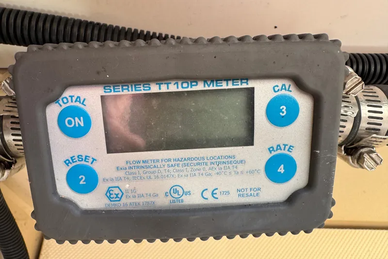 Slide: The Image of Flow meter display on 2018 Ranger Tugs R-27, Series TT10P, with control buttons. - 27