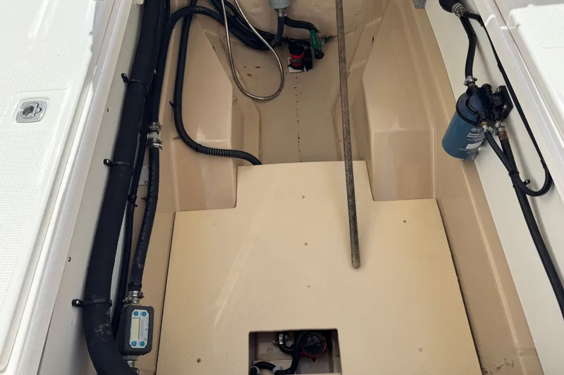 Slide: The Image of 2018 Ranger Tugs R-27 engine compartment with hoses and filter system. - 12