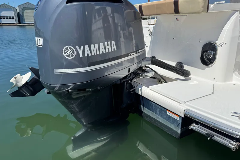Slide: The Image of Yamaha outboard motor on 2018 Ranger Tugs R-27 boat, docked in marina. - 3