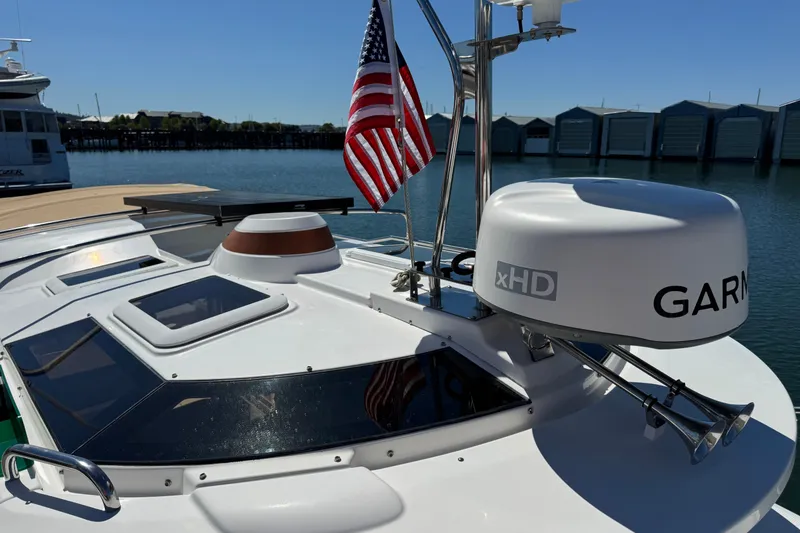 Slide: The Image of 2018 Ranger Tugs R-27 boat with Garmin radar and American flag at marina. - 25