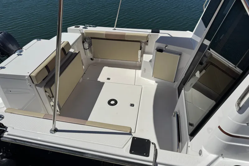 Slide: The Image of 2018 Ranger Tugs R-27 boat cockpit with seating, viewed from above. - 11