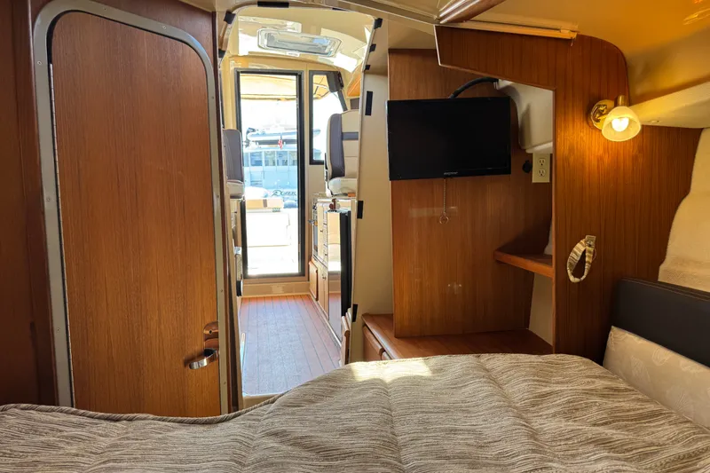 Slide: The Image of Interior of 2018 Ranger Tugs R-27 boat with cozy cabin and modern amenities. - 22