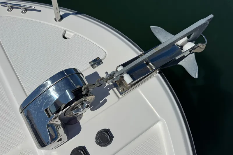 Slide: The Image of Anchor system on 2018 Ranger Tugs R-27 boat, featuring a polished winch and chain. - 26