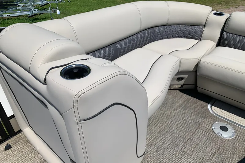 Slide: The Image of Luxurious seating on 2022 Barletta Lusso 23UC pontoon boat with cup holders and elegant upholstery. - 19