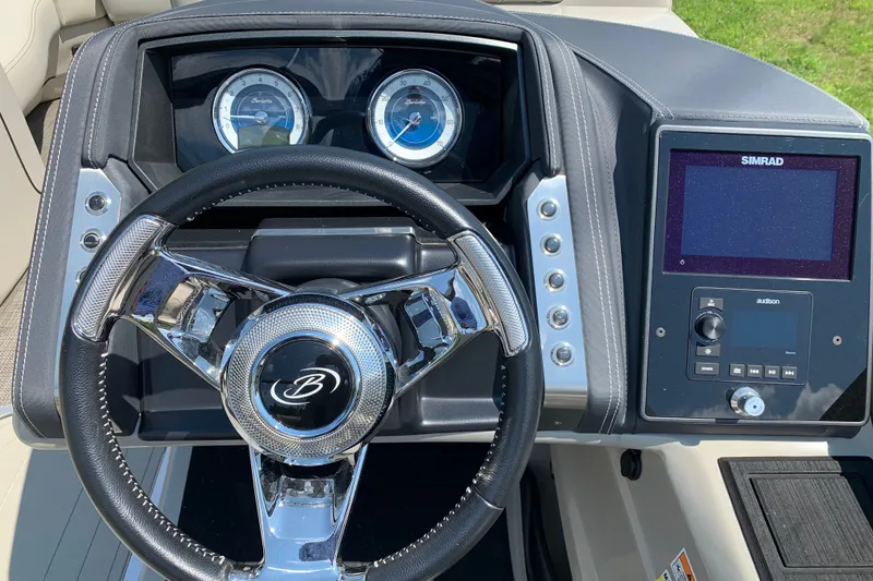 Slide: The Image of 2022 Barletta Lusso 23UC dashboard with steering wheel and Simrad display. - 13