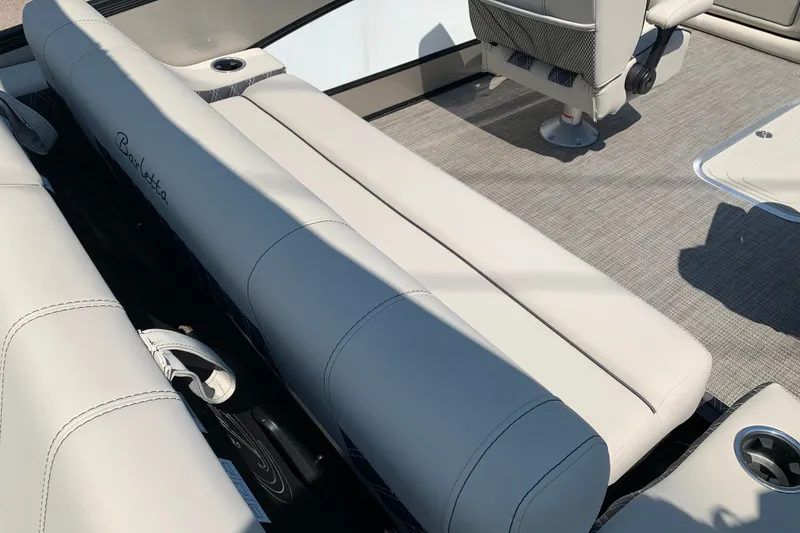 Slide: The Image of 2022 Barletta Lusso 23UC boat interior with plush seating and modern design. - 10