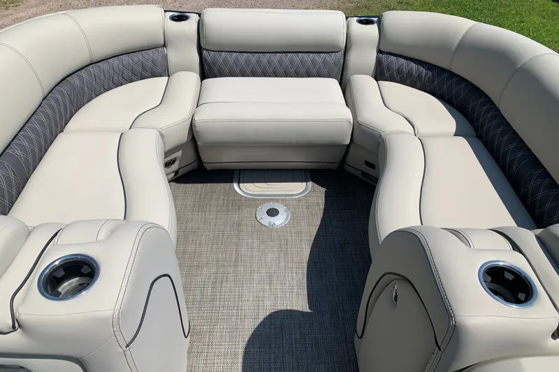 Slide: The Image of Luxurious seating on 2022 Barletta Lusso 23UC pontoon boat, featuring elegant upholstery and cup holders. - 16