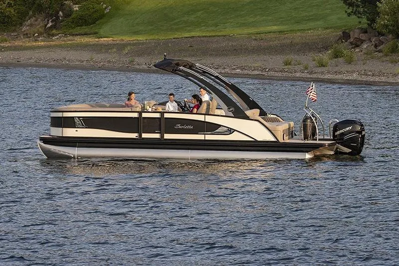 The Image of Manufacturer Provided Image: 2022 Barletta Lusso 23UC pontoon boat cruising on a lake with passengers. - 21