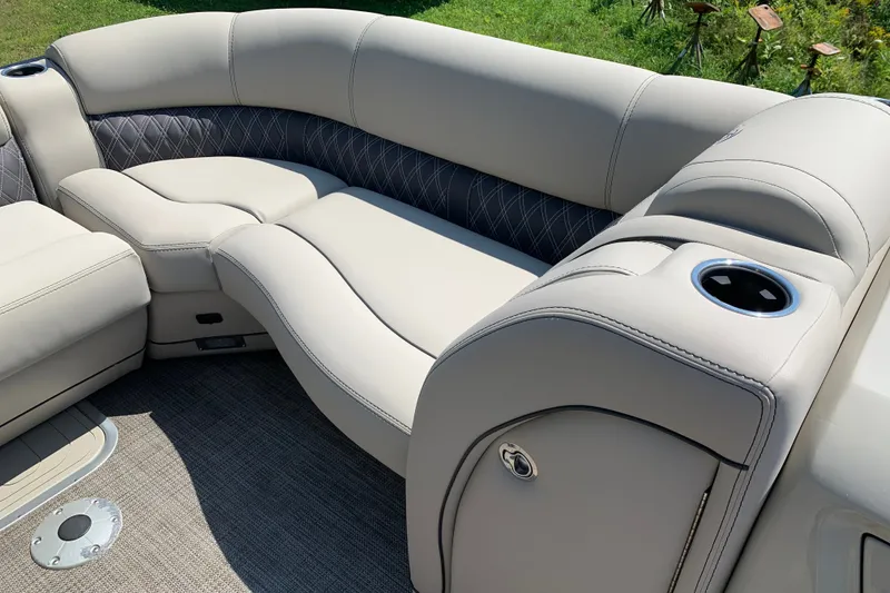 Slide: The Image of Luxurious seating on 2022 Barletta Lusso 23UC pontoon boat with cup holder and elegant design. - 17
