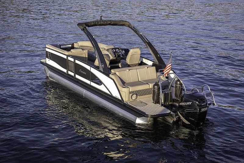 Slide: The Image of Manufacturer Provided Image: 2022 Barletta Lusso 23UC pontoon boat on water with Mercury outboard motor. - 22