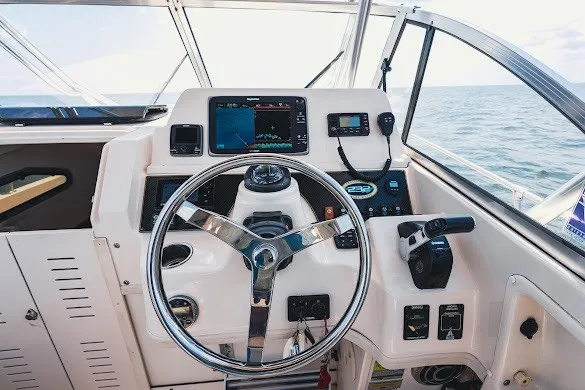 Slide: The Image of Helm of 2013 Grady-White Gulfstream 232 boat with navigation equipment and ocean view. - 21