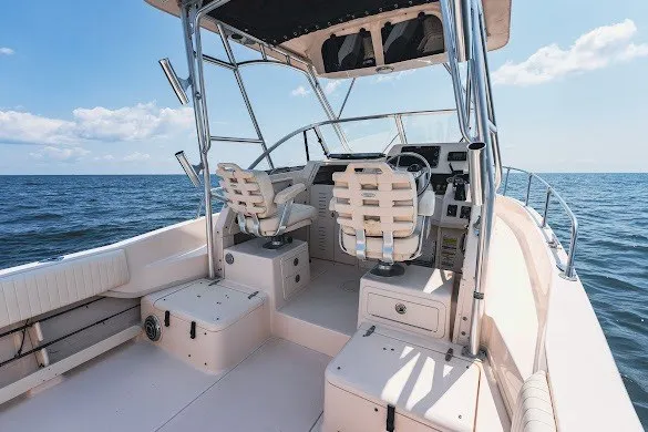Slide: The Image of 2013 Grady-White Gulfstream 232 boat interior with ocean view, featuring dual seats and helm. - 16