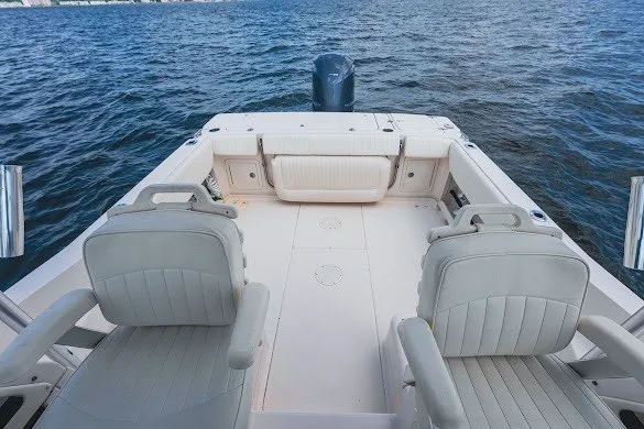 Slide: The Image of 2013 Grady-White Gulfstream 232 boat interior with seating, on open water. - 24