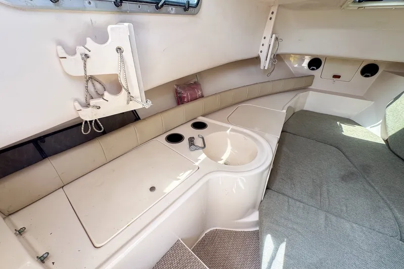 Slide: The Image of Interior of 2013 Grady-White Gulfstream 232 boat with seating and storage features. - 28