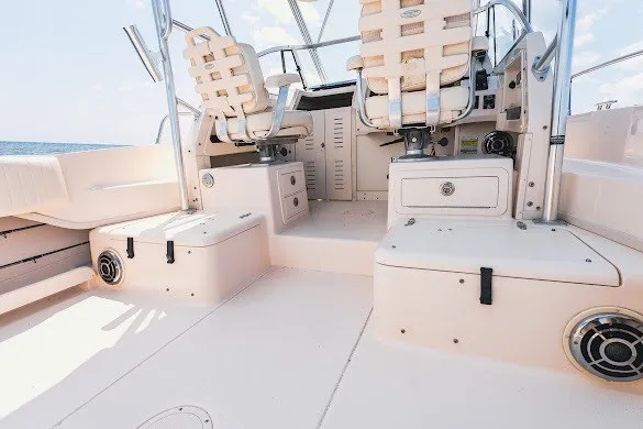 Slide: The Image of 2013 Grady-White Gulfstream 232 boat interior with seating and storage compartments. - 25